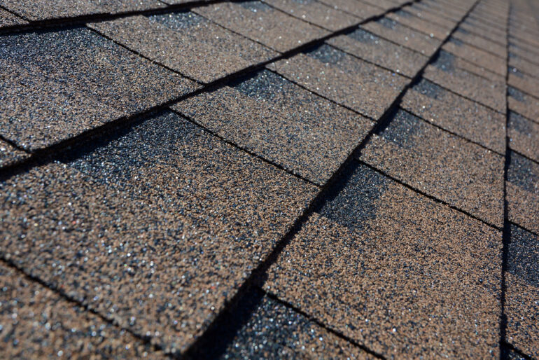 What kinds of toxins are released when burning roofing shingles