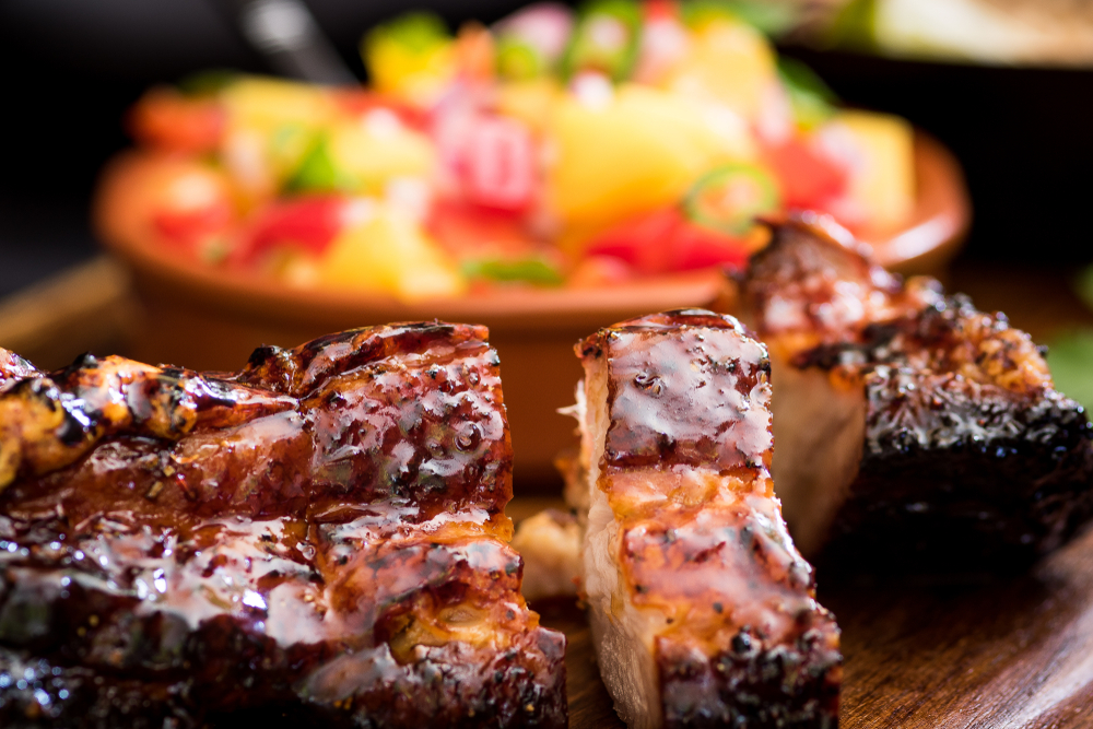 Close-up of grilled ribs with a jerk rub.