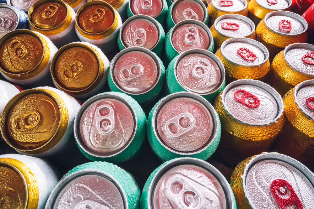 Rows of different-coloured beer cans.