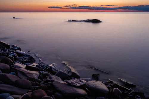 Pink and orange sunset over Lake Superior.
