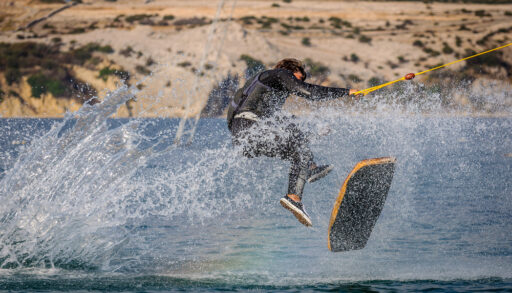Person wakeskating on a lake.