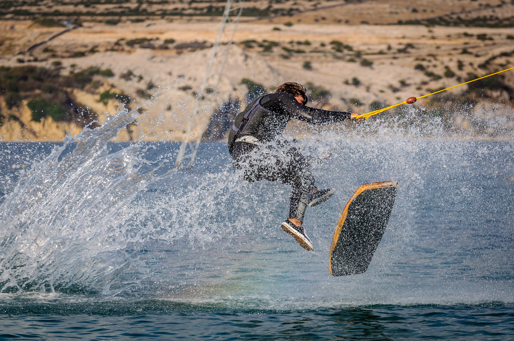 Person wakeskating on a lake.