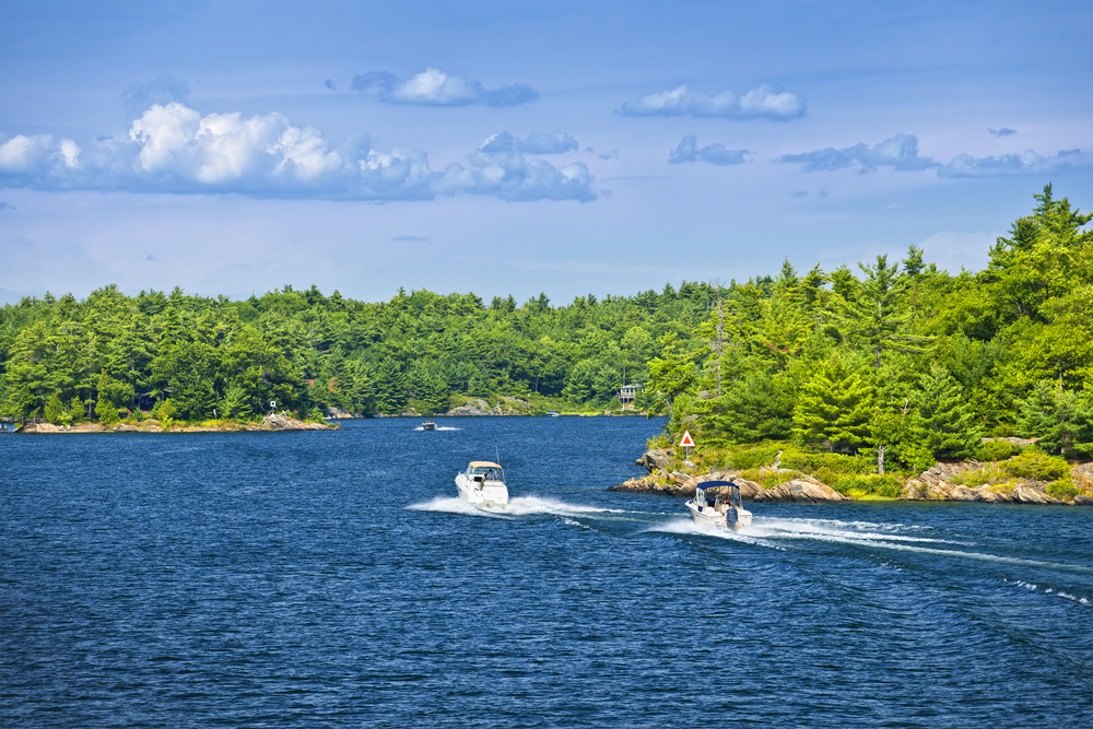 Two recreational boats on the blue waters of Georgian Bay near Parry Sound, Ontario.