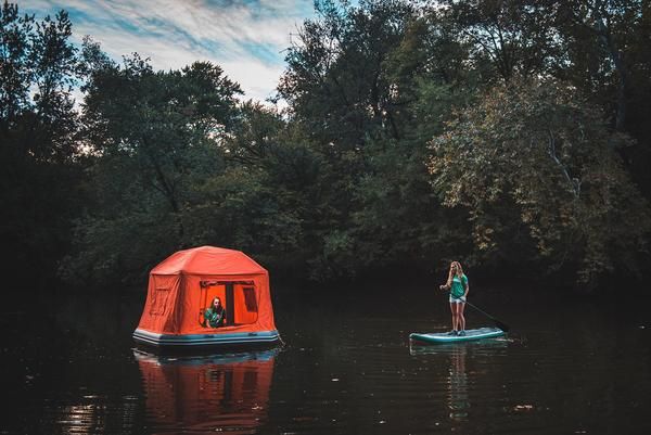 One girl in floating tent, another on stand-up paddleboard. Photo by Smithfly
