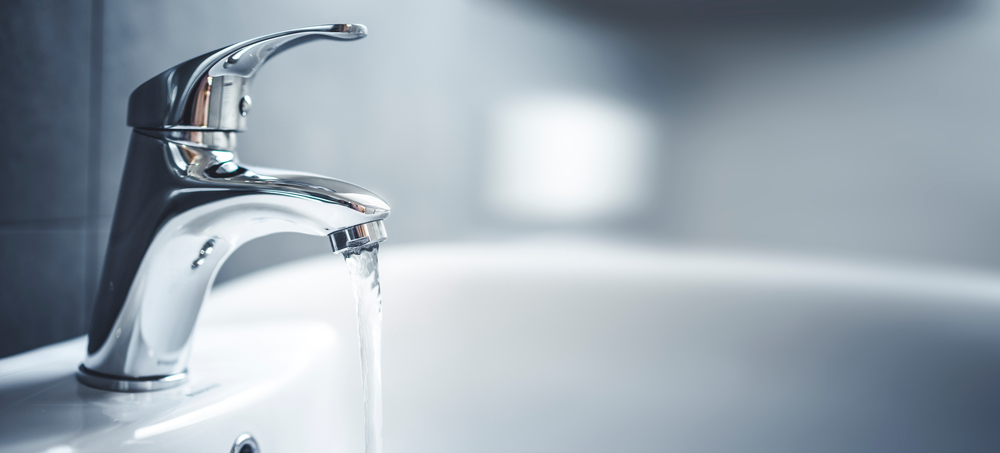 A faucet with water running from it