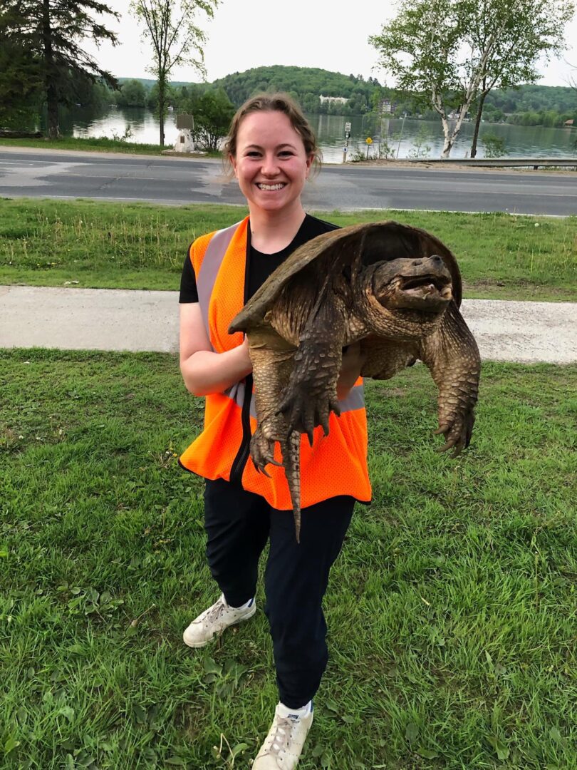 Grace being held by a volunteer