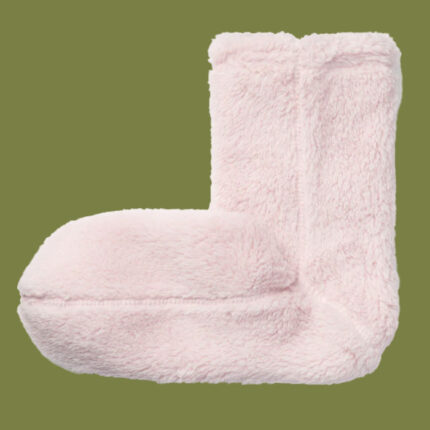 pink cozy socks against a green background