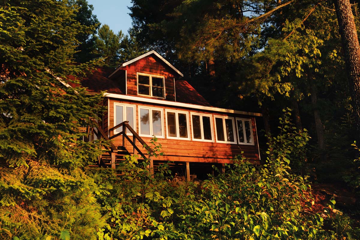 The cottage where Carley writes her bestselling books nestled among trees.