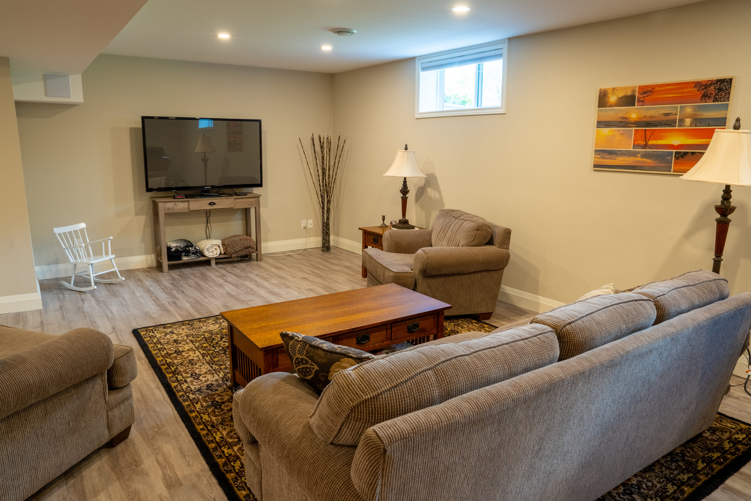 a living area with a couch and television