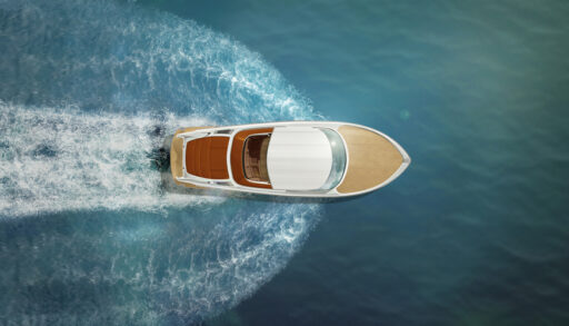 An overhead shot of a boat speeding through the water