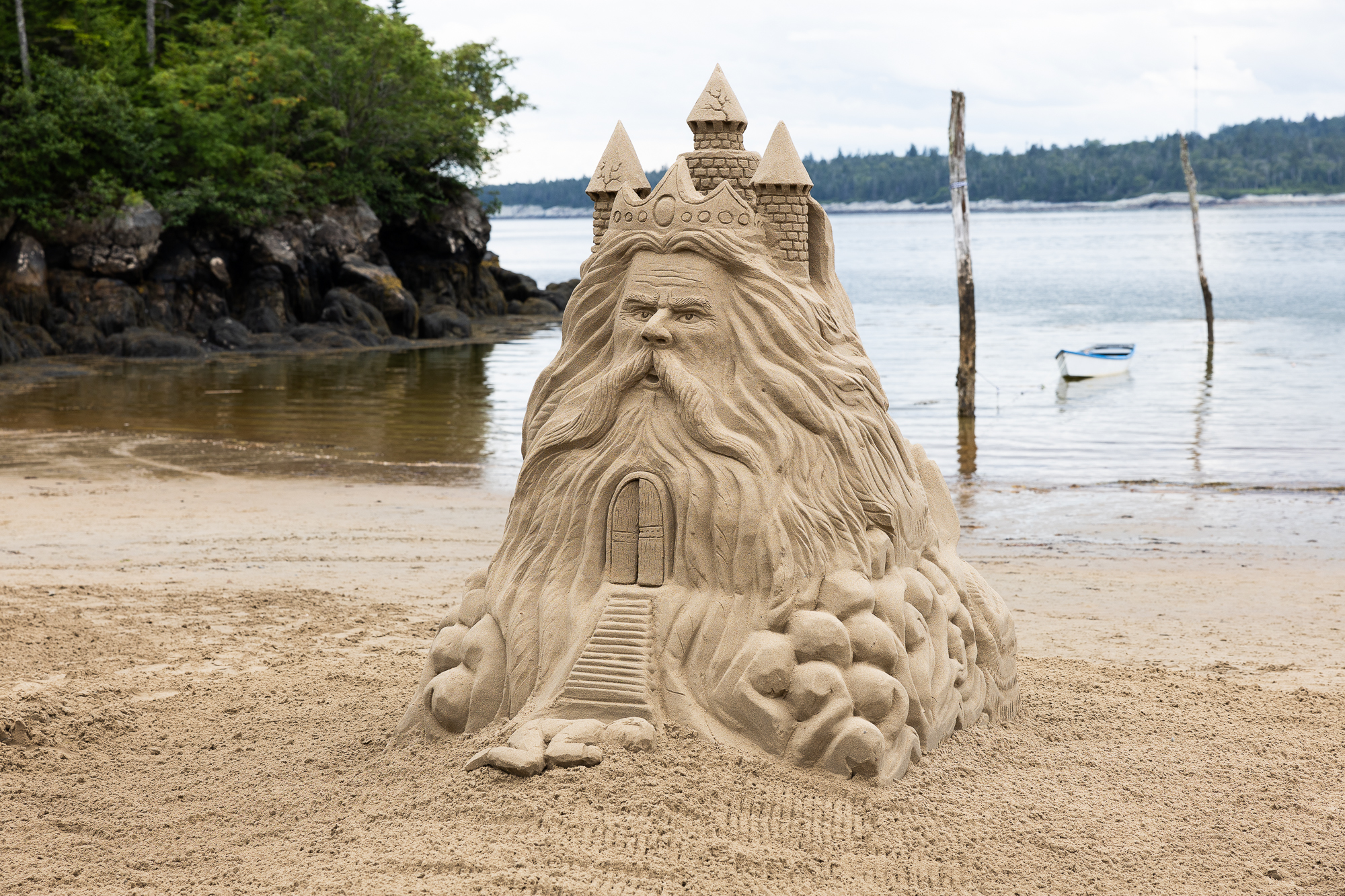 A sand sculpture of a bearded king