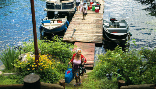 Auntie Rose brings up supplies from the dock where several boats are docked