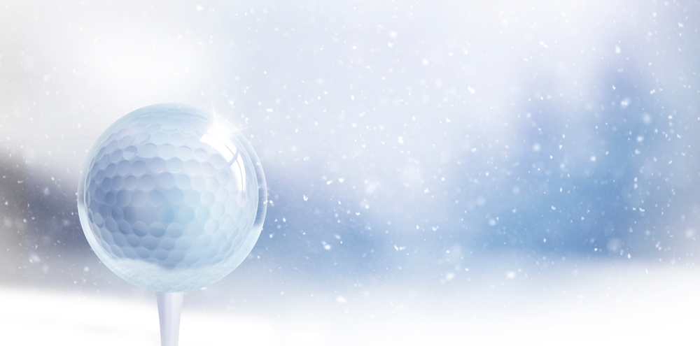Close-up of a golf ball in the snow