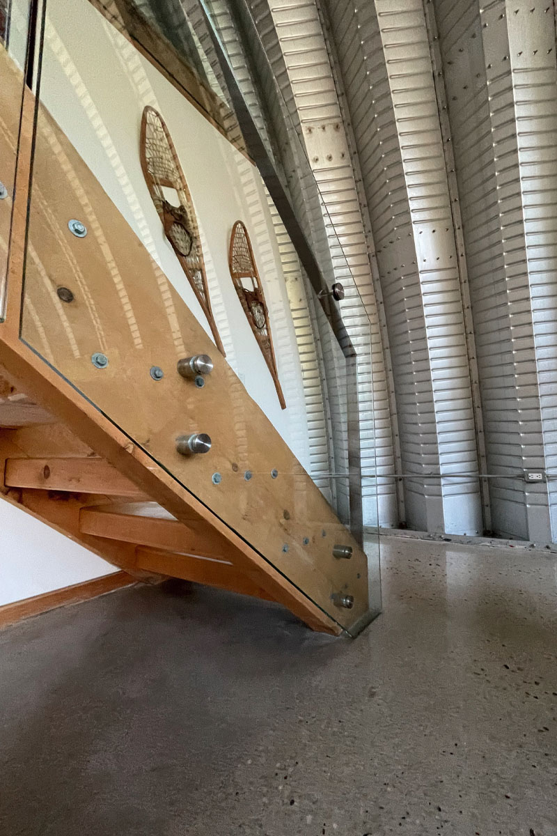 a staircase with a glass railing