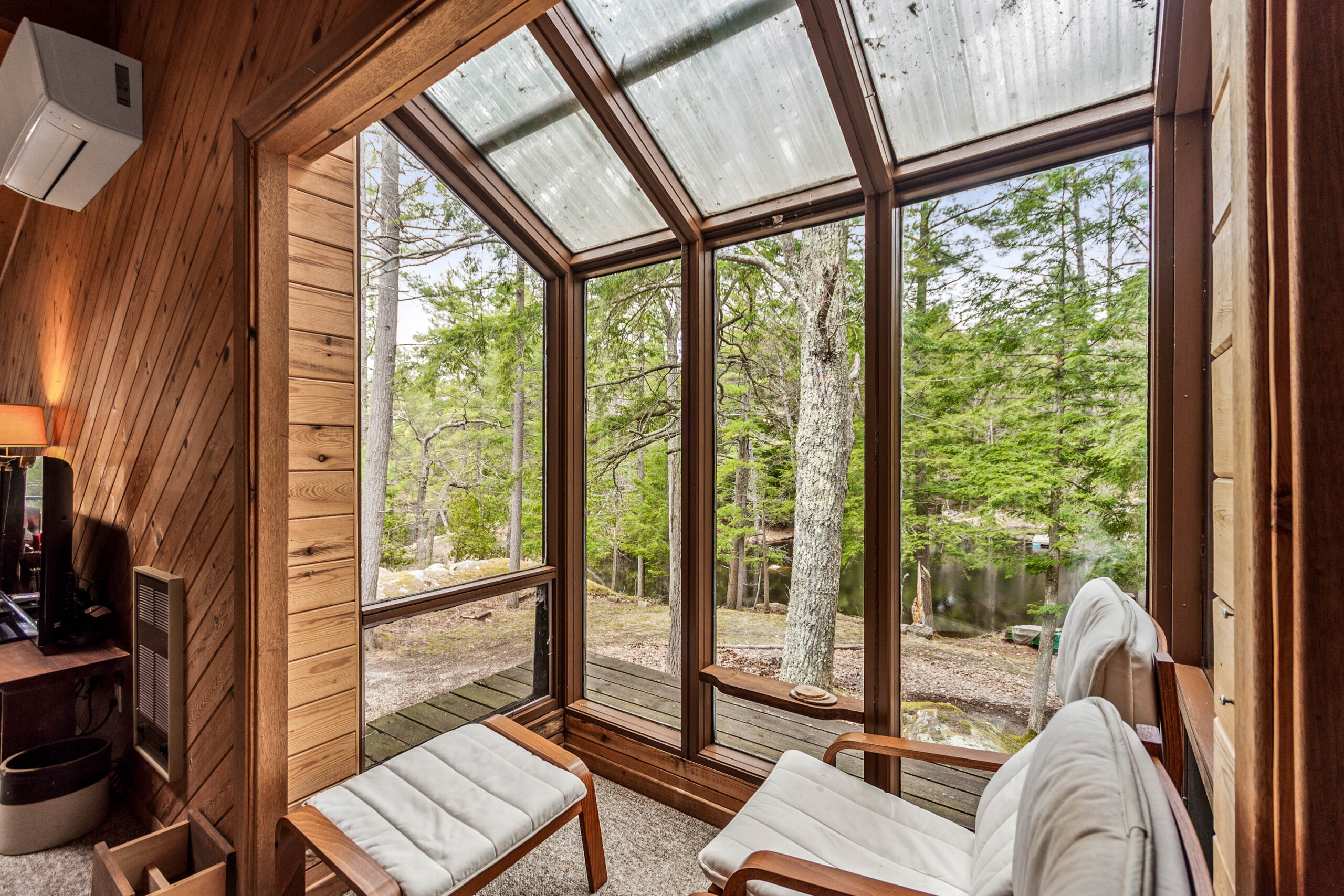 A small sitting area by a glass-paneled wall