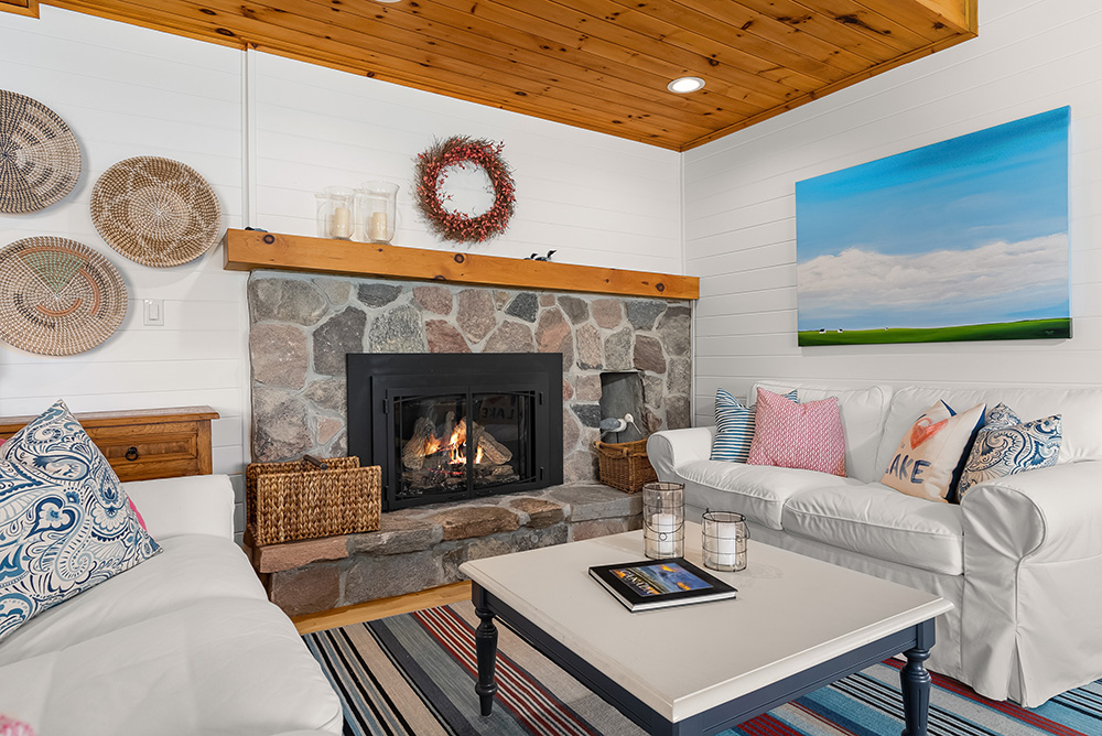Inviting living room centered around a gas fireplace with cottage-style décor