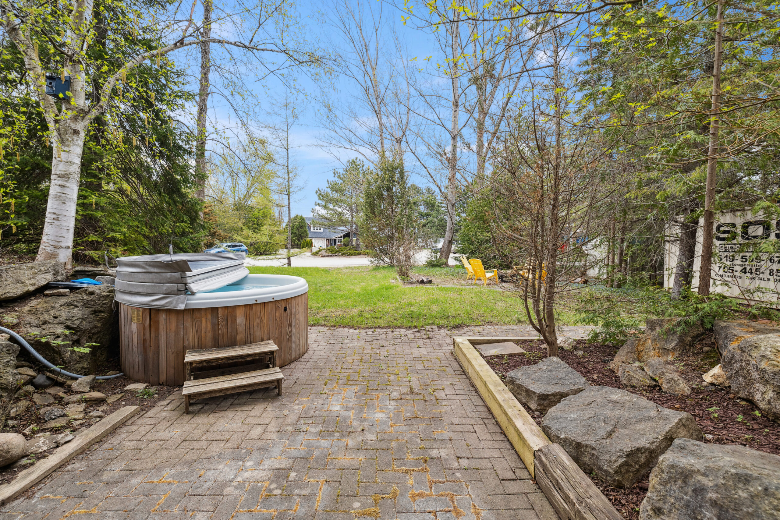 A partially-open hot tub on a lawn