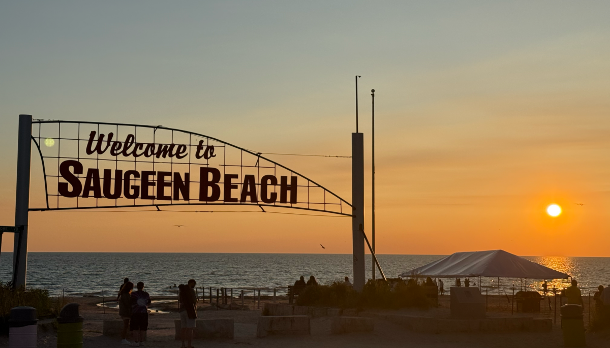 Welcome to Saugeen Beach sign at sunset