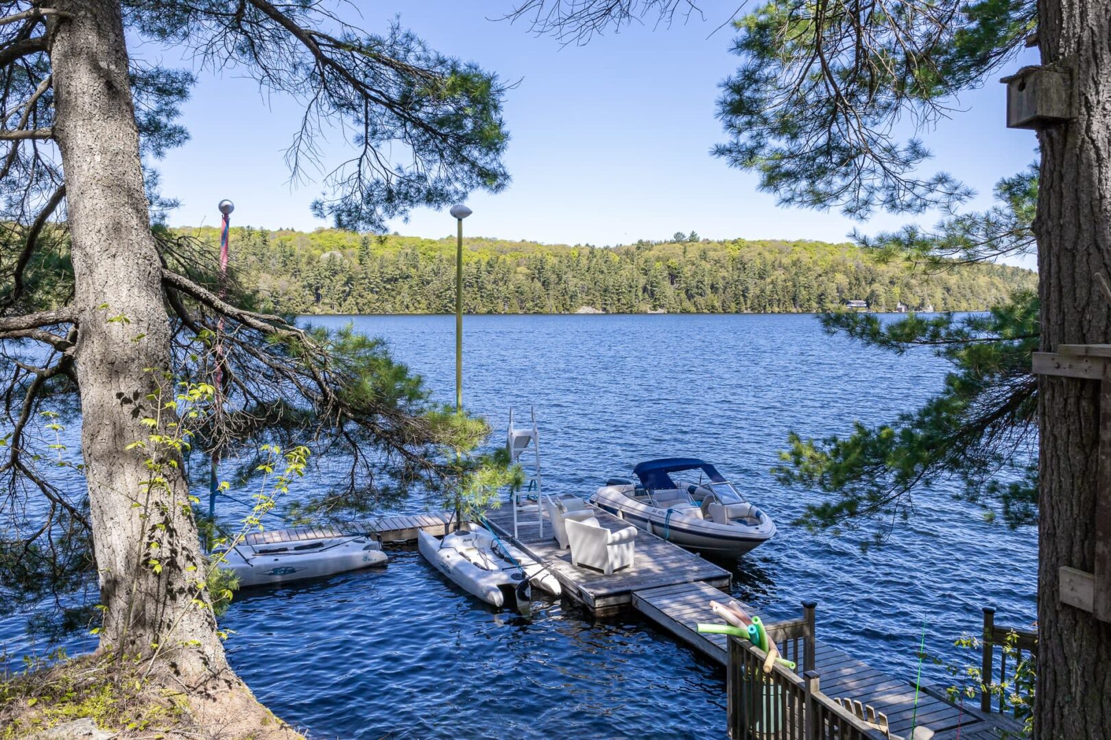 Boats docked in dark blue water