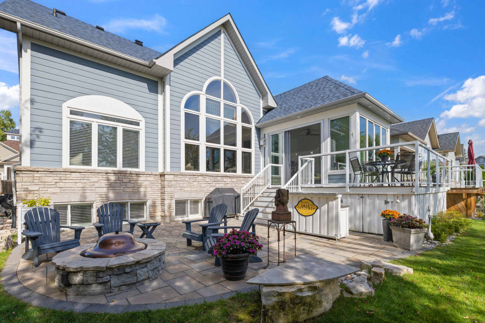 A grey cottage with huge cathedral windows