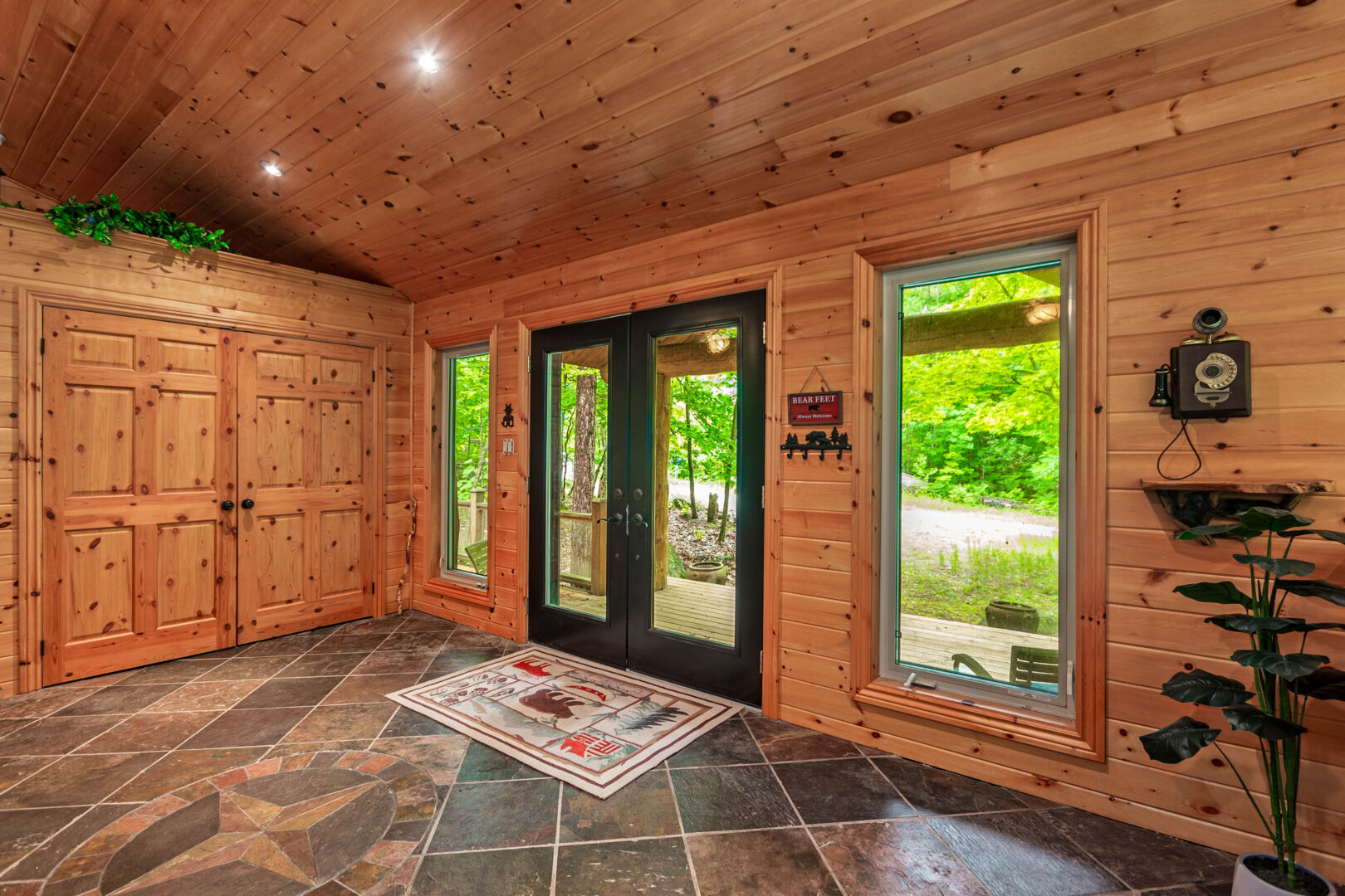 Double glass doors in a wood cabin entryway