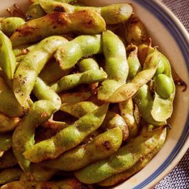 Grilled ginger-garlic edamame in a bowl