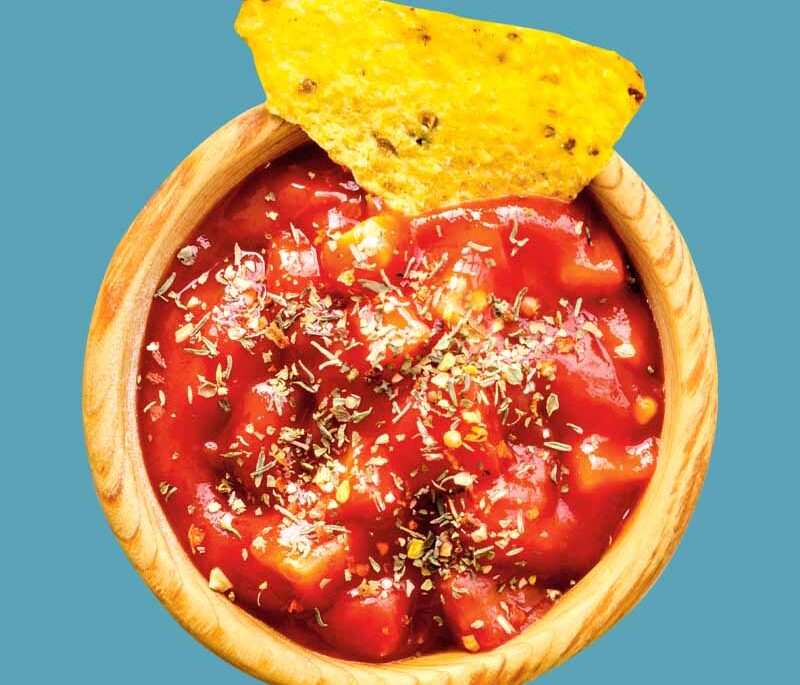 Salsa with a tortilla chip in it